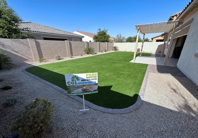 CGL Landscaping yard sign on a completed artificial turf backyard installation