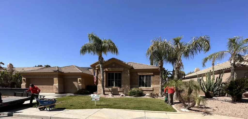 CGL crew finishing a front yard with lawn, palm trees and desert plants