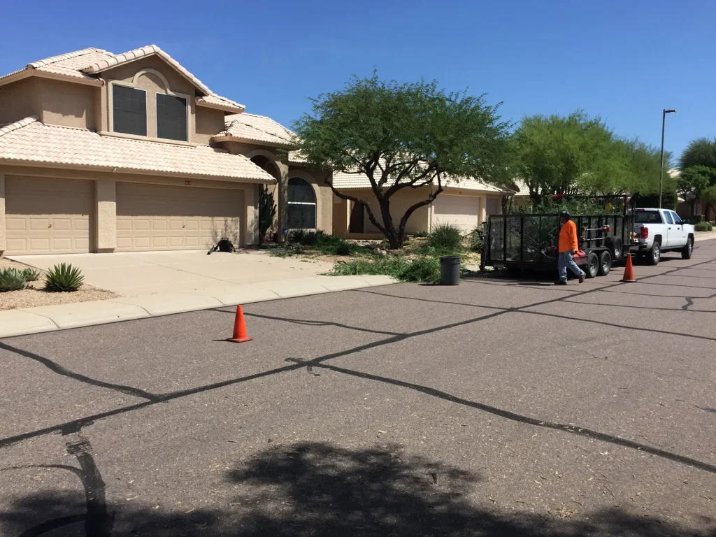 CGL crew and trailer on a front yard job, with traffic cones out on the street