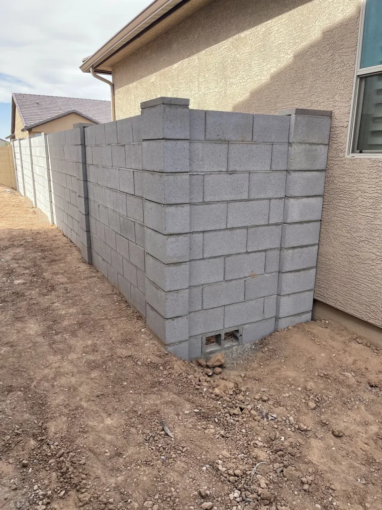 New block wall built along the side of a home