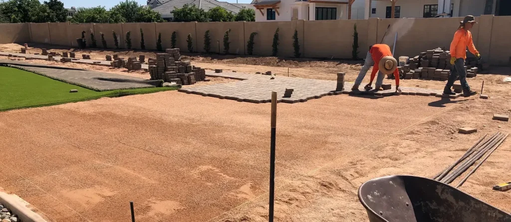 CGL crew building and compacting the aggregate base before turf goes down