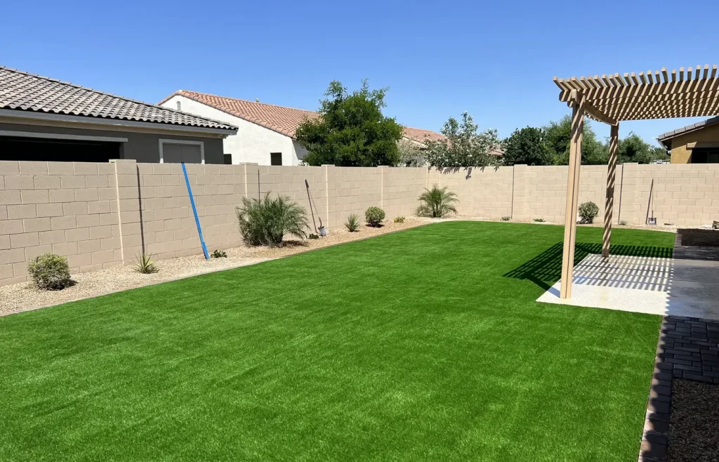 Artificial turf backyard lawn with a pergola in Chandler AZ